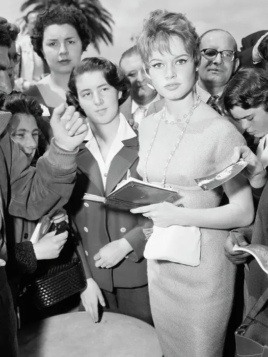 Framed Print : Brigitte Bardot Signs Autographs with Fans Framed Print : Brigitte Bardot Signs Autographs with Fans