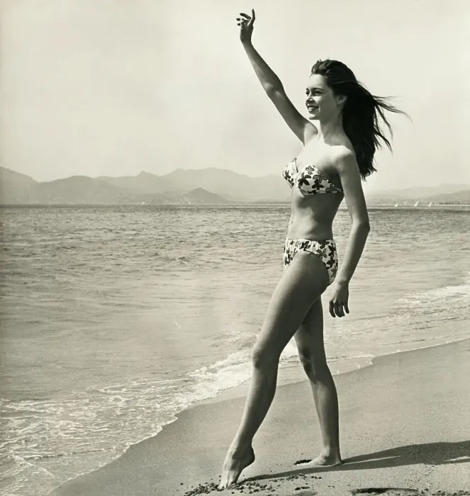 Framed Print : Brigitte Bardot Waving on the Beach Framed Print : Brigitte Bardot Waving on the Beach