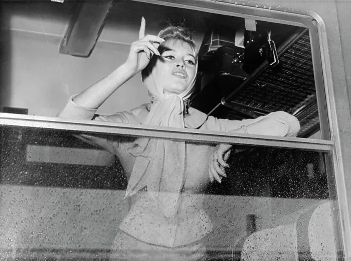 Framed Print : Brigitte Bardot Waving Goodbye from Window Framed Print : Brigitte Bardot Waving Goodbye from Window
