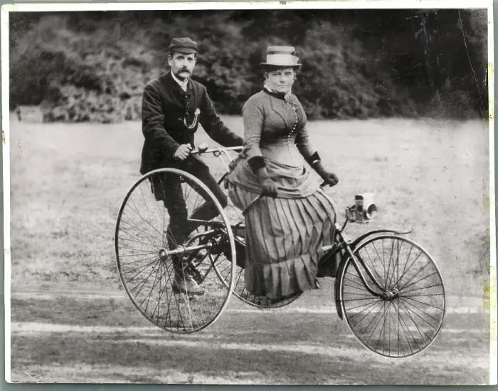 Framed Print : British Couple Riding Tricycle Framed Print : British Couple Riding Tricycle
