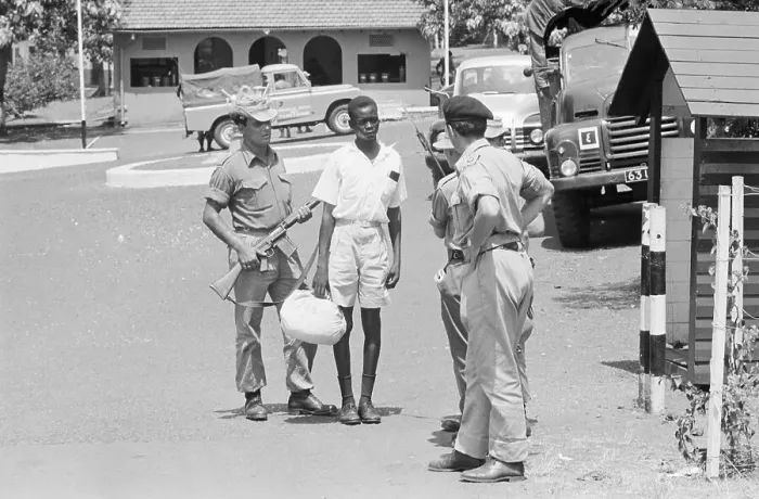 Framed Print : British Soldiers Keep Ugandan at Gunpoint Framed Print : British Soldiers Keep Ugandan at Gunpoint