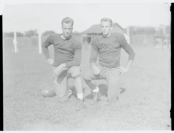 Framed Print : Brother Football Players Kneeling on Field Framed Print : Brother Football Players Kneeling on Field
