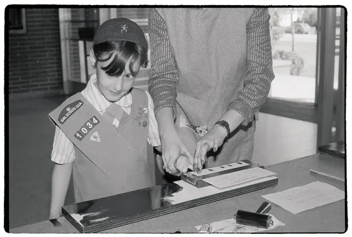 Framed Print : Brownie Scout Getting Fingerprinted