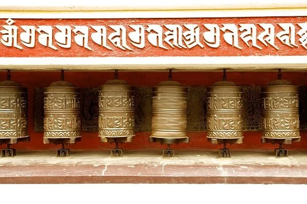 Buddhist prayer wheels on the exterior wall of the Swayambhunath Stupa Temple, also called Monkey Temple, Kathmandu, Nepal, Asia