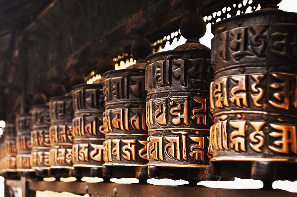 Buddhist prayer wheels in a temple, Swayambhunath, Kathmandu, Nepal