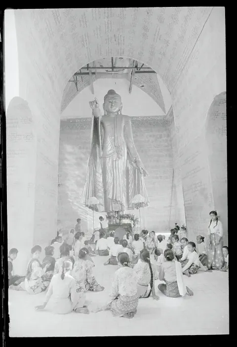 Framed Print : Buddhists Underneath Statue Framed Print : Buddhists Underneath Statue