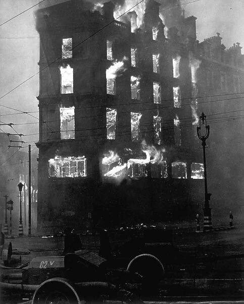 Building Ablaze. 1941: Flames shoot out from all floors of the Negretti