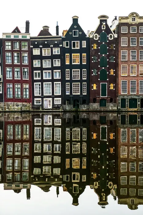 Framed Print : Building facades with a mirror image reflecting in a canal Framed Print : Building facades with a mirror image reflecting in a canal