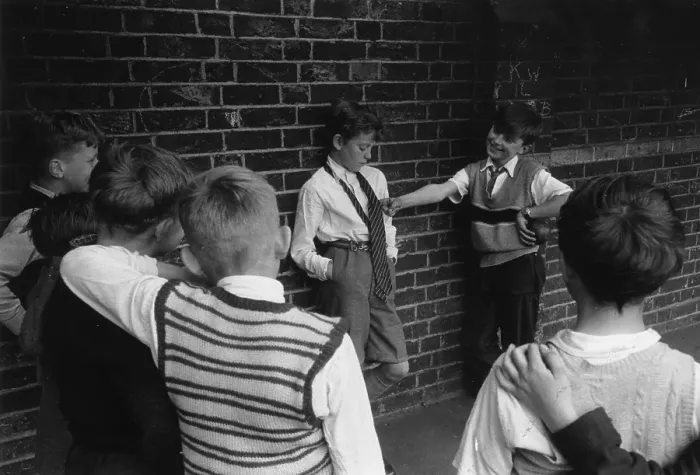 Framed Print : Bullying. 22nd June 1956: Children bullying a boy in a playground Framed Print : Bullying. 22nd June 1956: Children bullying a boy in a playground