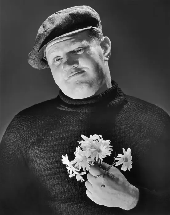 Framed Print : A burly man holding a posy of flowers, circa 1955 Framed Print : A burly man holding a posy of flowers, circa 1955