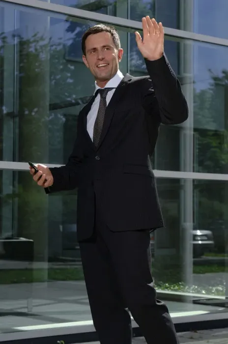 Framed Print : Business man greeting someone outside a bank