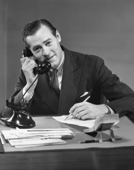 Framed Print : Businessman at desk on telephone Framed Print : Businessman at desk on telephone