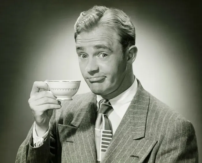 Framed Print : Businessman holding ceramic cup, (B&W), portrait Framed Print : Businessman holding ceramic cup, (B&W), portrait