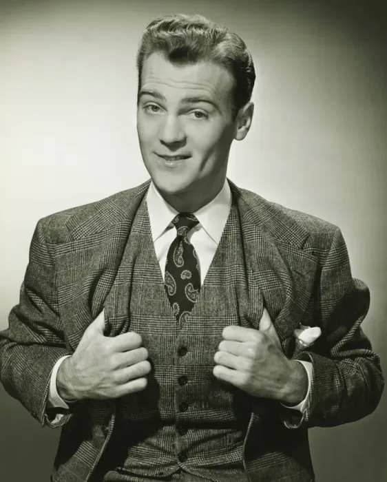 Framed Print : Businessman holding thumbs in waistcoat, smiling, (B&W), portrait