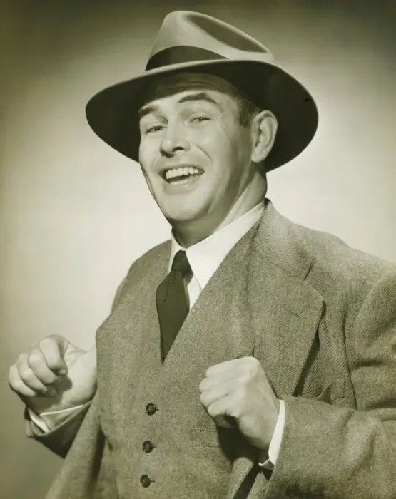 Framed Print : Businessman holding thumbs in waistcoat, smiling, (B&W), portrait