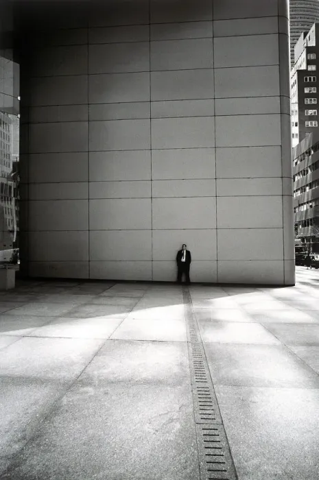 Framed Print : Businessman leaning against wall Framed Print : Businessman leaning against wall