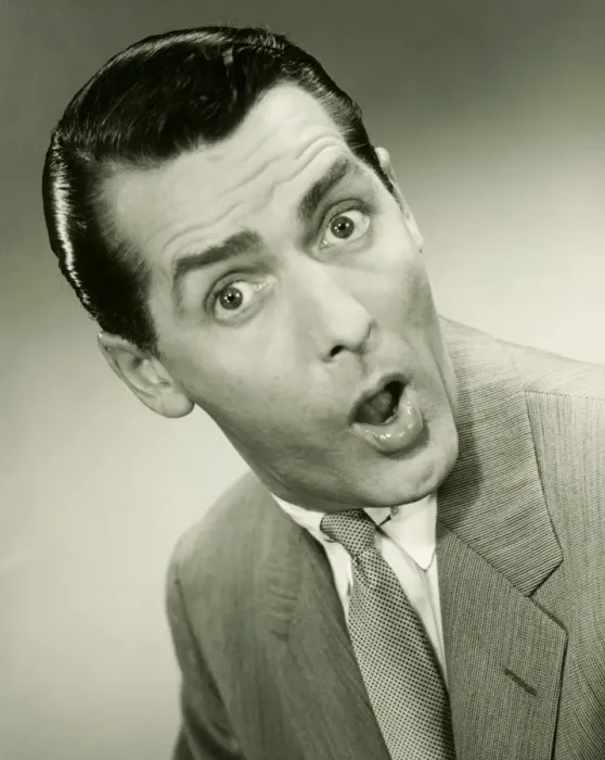 Framed Print : Businessman looking surprised, posing in studio, (B&W), portrait Framed Print : Businessman looking surprised, posing in studio, (B&W), portrait
