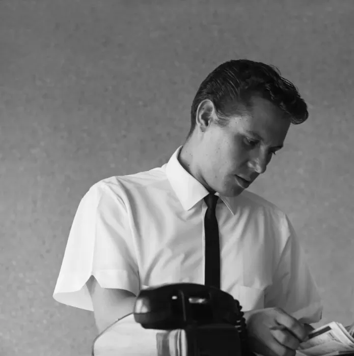 Framed Print : Businessman looking at telephone diary Framed Print : Businessman looking at telephone diary