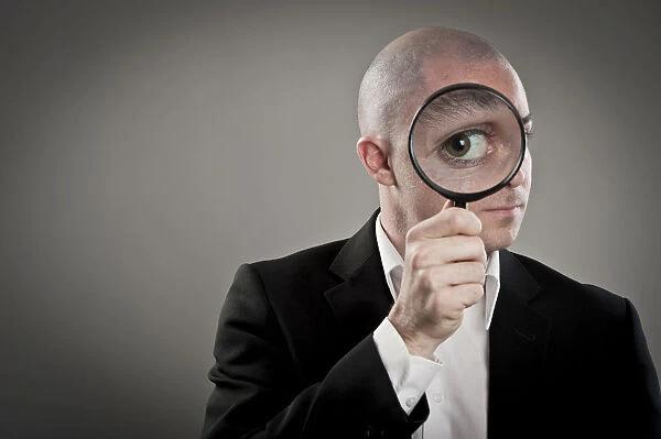 Businessman with magnifying glass