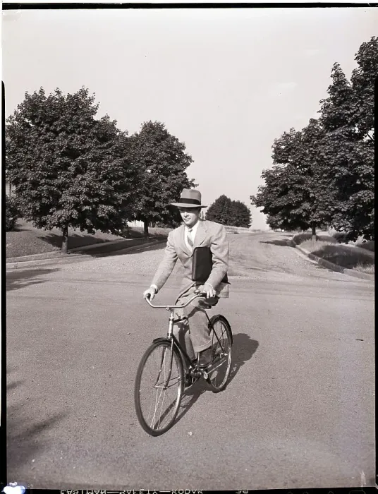 Framed Print : Businessman Riding a Bicycle Framed Print : Businessman Riding a Bicycle