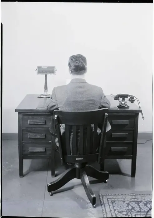Framed Print : Businessman Sitting at a Desk Framed Print : Businessman Sitting at a Desk
