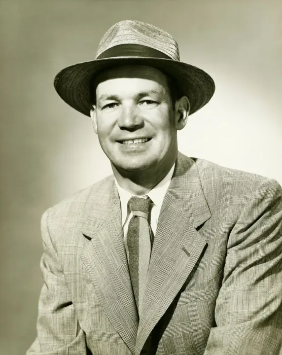 Framed Print : Businessman wearing fedora hat, smiling, (B&W), portrait Framed Print : Businessman wearing fedora hat, smiling, (B&W), portrait