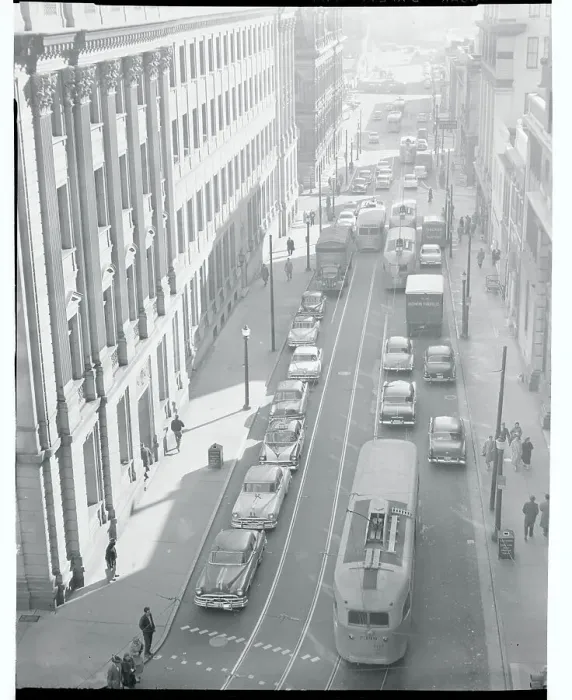 Framed Print : Busses and Cars Driving Down a City Street Framed Print : Busses and Cars Driving Down a City Street