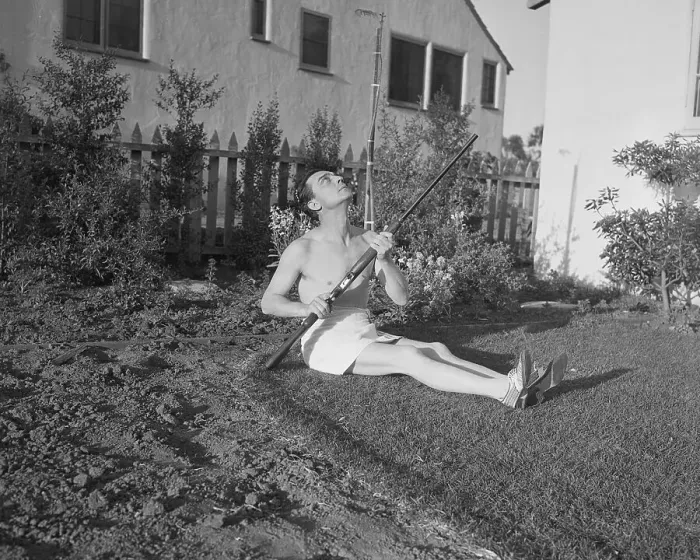 Framed Print : Buster Keaton Sunbathing with Shotgun
