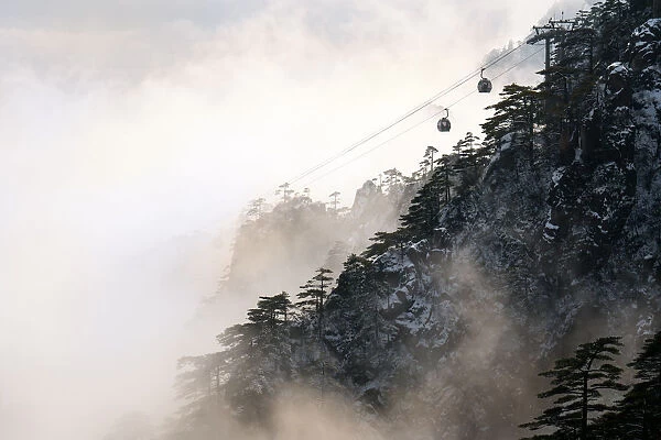 Cable car on Huangshan mountain in foggy day