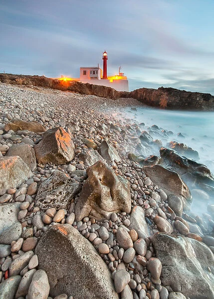 Light. Cabo Raso lighthouse and fort of Saint Bras near Guincho beach in Cascais area