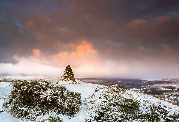 Cairn on snow covered hill fort at Cwmyoy near Abergavenny in the Black Mountains