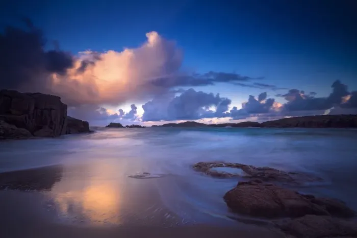 Framed Print : Calm waves on beach at sunset
