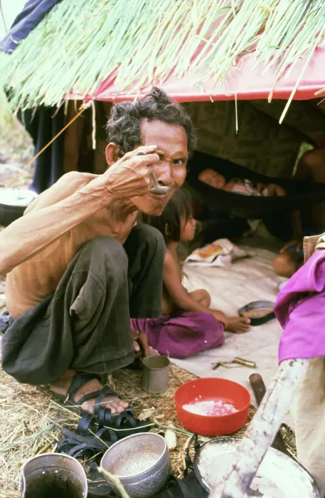 Framed Print : Cambodian Refugee Eating Framed Print : Cambodian Refugee Eating
