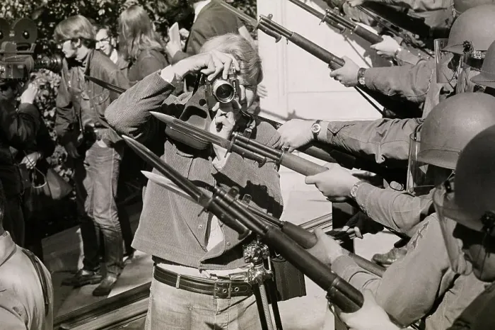 Framed Print : Cameraman Standing Between National Guard Bayonets