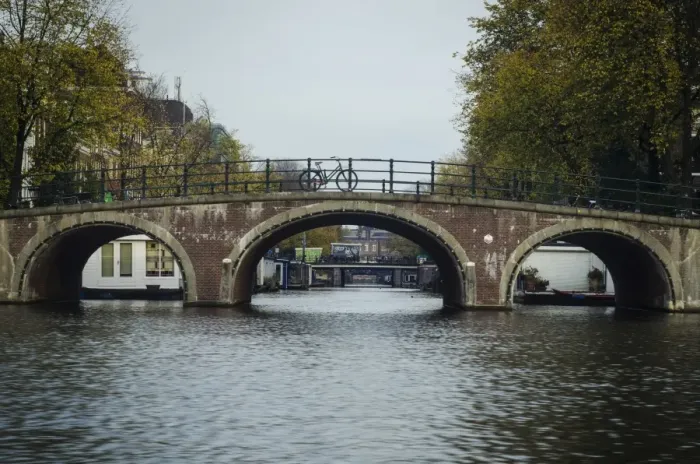 Framed Print : A Canal Bridge in the Capital City of Amsterdam, Netherlands Framed Print : A Canal Bridge in the Capital City of Amsterdam, Netherlands