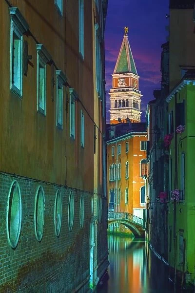 Canal in Venice in the night with the Campanile in the background