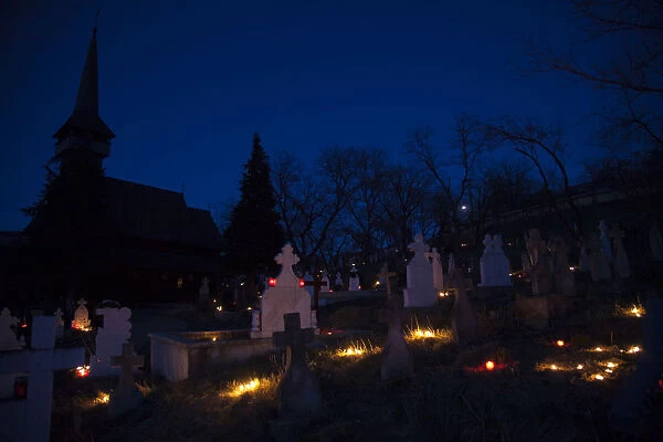 Candles lit at the cemetery of an orthodox church