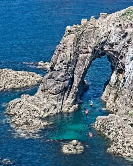 Framed Print : Canoeists at lands end, Cornwall Framed Print : Canoeists at lands end, Cornwall