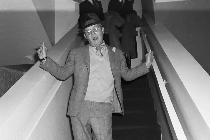 Framed Print : Capote On Stairs Waving / Waist Up 1978 Framed Print : Capote On Stairs Waving / Waist Up 1978
