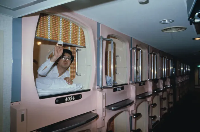 Framed Print : Capsule Hotel Guest Closing His Room Door Framed Print : Capsule Hotel Guest Closing His Room Door