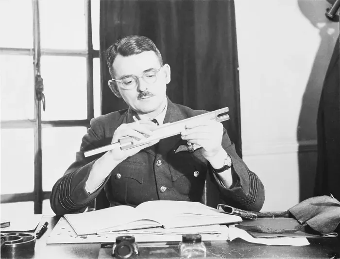 Framed Print : Captain Frank Whittle Using Slide Rule at His Desk Framed Print : Captain Frank Whittle Using Slide Rule at His Desk