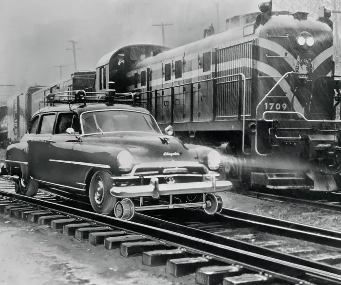 Framed Print : Car Riding the Rails Next to a Train Framed Print : Car Riding the Rails Next to a Train