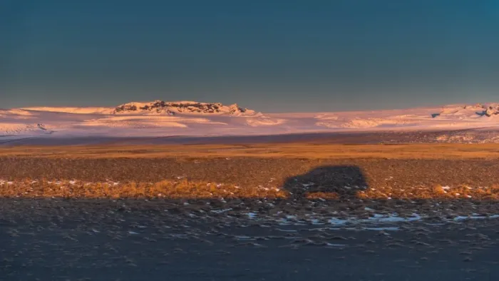 Framed Print : a car shadow cast on an iceland landscape