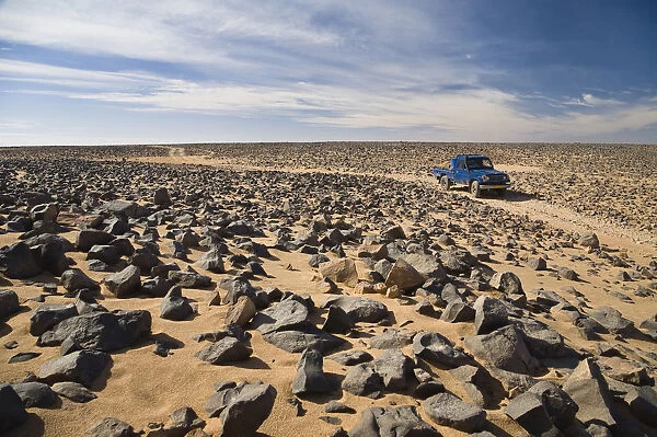 Car track in stone desert, Akakus Mountains, Libya, Sahara, North Africa