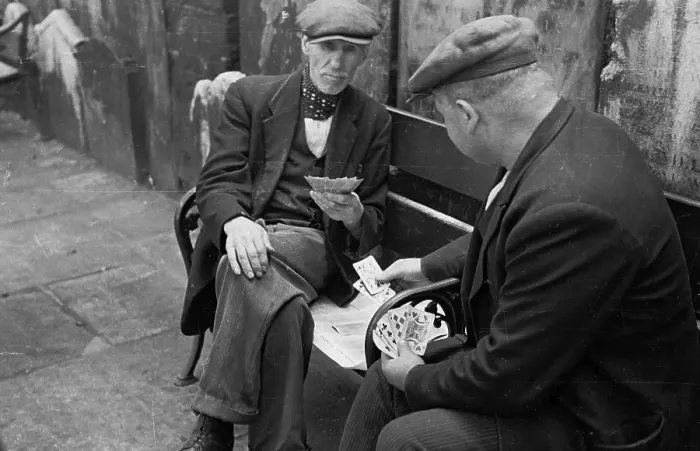 Framed Print : Card Game. 15th October 1938: Two old men playing cards in the graveyard