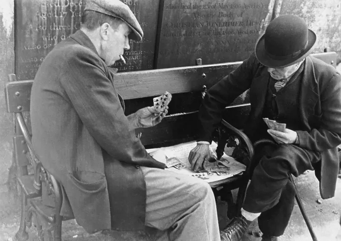 Framed Print : Card Game. 15th October 1938: Two old men playing cards in the graveyard