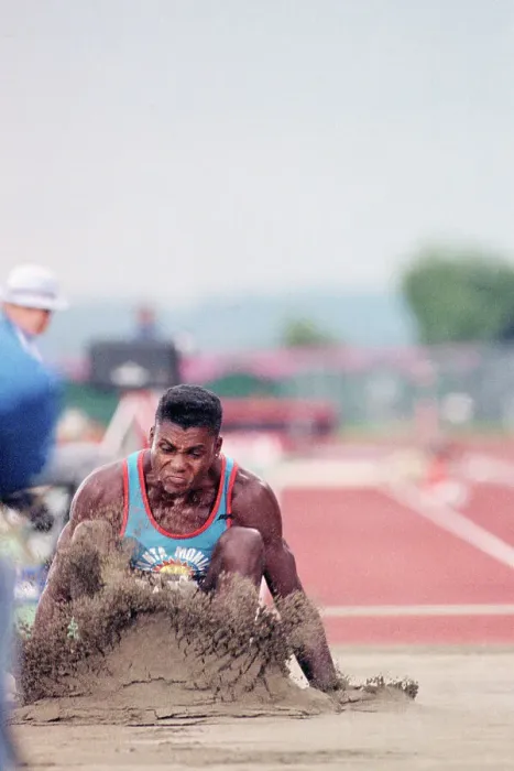 Framed Print : Carl Lewis Lands In Sand After Long Jump Framed Print : Carl Lewis Lands In Sand After Long Jump
