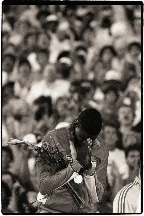 Framed Print : Carl Lewis Prays at Olympic Ceremony Framed Print : Carl Lewis Prays at Olympic Ceremony