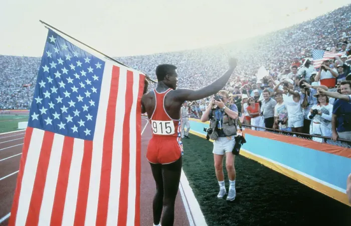 Framed Print : Carl Lewis Running with American Flag Framed Print : Carl Lewis Running with American Flag