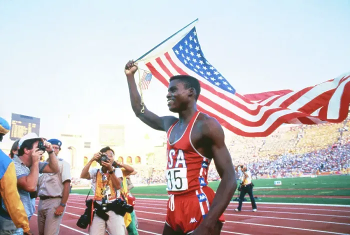 Framed Print : Carl Lewis Running with American Flag Framed Print : Carl Lewis Running with American Flag